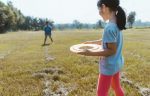 children-play-frisbee-on-a-sunny-day_t20_4bdBmx