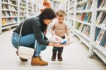 cute-baby-boy-toddler-child-in-bookstore-with-mother-with-open-book_t20_7yP60N
